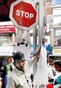 Time for innovation: ‘Stop’ and buy  a banian seems to be the call of this vendor. Pix by M.A. Pushpa Kumara