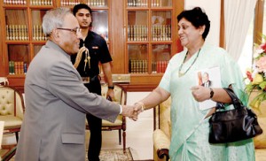 Suganthie Kadirgamar being received  by Indian President Pranab Mukherjee when she came to present him with a copy of the book.