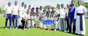 The champion St. Peter’s team with officials. 							             - Pix by Ranjith Perera