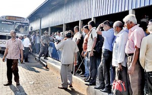 Main bus stand in the  Pettah: Commuters waiting to head home to Kandy on Friday.  Pic by Indika Handuwala