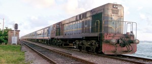 A Class M4 MLW Alco Bombardier, No. 752 ("Point Pedro") heads 'Muthu Kumari' - an office-time train that has hauled passengers from points as far apart as Panadura and Puttalam, without once pausing to ask if they were Sinhalese, Tamils, Muslims, Burghers, or any other - an exemplary and ethnically agnostic railway ethic