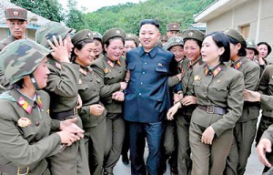 Frontline females:: North Korean dictator Kim Jong Un with female members of the Korean People's Army Unit 4302 in an undated picture. Many of the artillery units along the coasts are manned by women