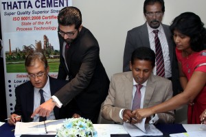 Pic by M.A. Pushpa Kumara shows SLPA Chairman Dr. Priyath Bandu Wickrama and THAATA Cement CEO Fazlullah Shariff signing the Business Venture Agreement  in Colombo last Friday.