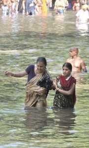 Pilgrims take a dip in the Menik Ganga