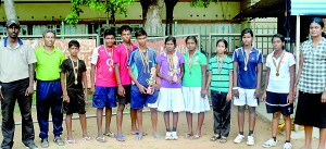 The victorious Jaffna men and women table tennis players with their awards and medals from the District Championship