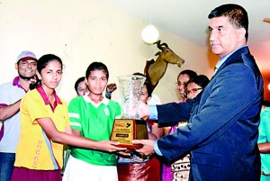 Ahinsa Premaratne of Pushpadana GS and Samadara Chandrika of Seetha Devi GS receiving the trophy as joint champions of the girls segment.