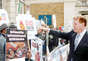 Canadian Minister of Foreign Affairs John Baird attended the CMAG meeting at Marlborough House on Friday. Later, he also took part at a news conference.  When he was driven away to his hotel, he found a group of anti-Sri Lanka protestors. He alighted  from his car to speak to them and shake their hands before resuming his journey.