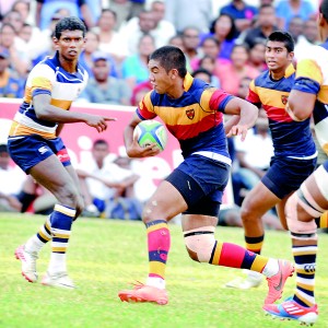 Trinity’s Sanchana Sheik in perfect control, glides through the St. Peter’s defense in their schools rugby encounter which ended the home team’s winning streak.  								          - Pic by Ranjith Perera