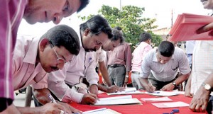 Rare unity: People from all walks of life signing the petition.