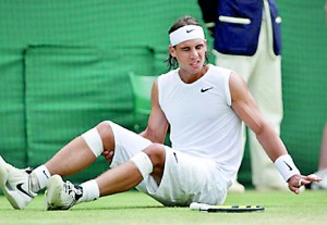 Spain's Rafael Nadal lies on the court a