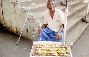 Her husband sells clay oil lamps at the premises