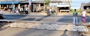 Decorative paving stones used in gardens and pavements in Colombo seem to have been used to keep the tracks in place