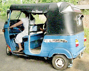 On the road: Priyani in the three wheeler gifted to them by Mrs. Kobbekaduwa