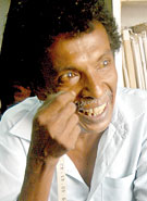 Sanath Wanigasekera: No option but to increase his tailoring charges. Pix by Nilan Maligaspe