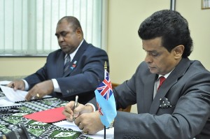 Seen here Mr. Parakrama Dissanayake (right) signing the agreement.