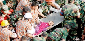 Bangladeshi rescuers retrieve worker Reshma from the rubble of a collapsed building in Savar on May 10, seventeen days after the building collapsed (AFP)