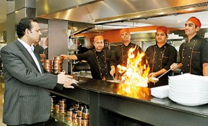 Dishing it all up: Faiz Basheer has a word with his chefs. Pix by Susantha Liyanawatte