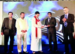Picture shows Association President Indika Sampath Merenchige handing over the first copy of the directory to Economic Development Minister Basil Rajapaksa.