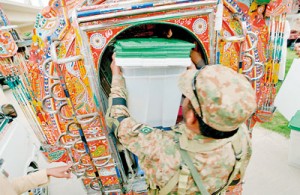 A Pakistani army soldier loads ballot boxes into a van at the  distribution point in Rawalpindi on May 10 (AFP)
