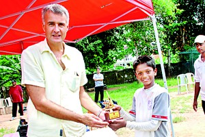The Man of the Series Rahul Rajesh receiving his award from the Head of Primary and Deputy Principal David Goodwin