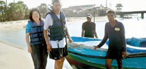 The writer and his wife Yoke-Sim with two navy recruits and the boat  that took them to Adam’s Bridge