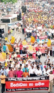 Show of strength: The joint opposition parties and trade unions take to the streets. Pic by Amila Praboda