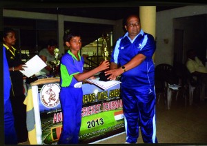 Imtiaz Ahamed CA ……. Under 12 team.Receiving the runner-up trophy from Harsha Peiris, the CEO of the CCC School of Cricket.