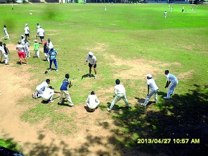 Paul McEwan plays  a game with junior cricketers of St Thomas’ College Matara