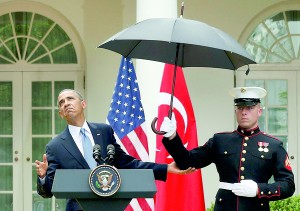 Broken Regulations: US Marines hold umbrellas during light rain for US President Barack Obama and Turkish Prime Minister Recep Tayyip Erdogan (not pictured)