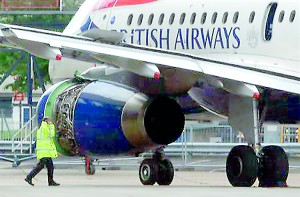 A worker walks past a British Airways passenger jet following an emergency landing at Heathrow Airport west of London (Reuters)