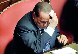 People of Freedom (PDL) party member and former Prime Minister Silvio Berlusconi wipes his forehead as he attends the Upper house of the parliament in Rome (Reuters)
