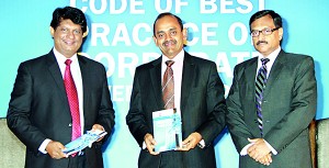 Picture shows the new Code of Best Practice on Corporate Governance being presented to Dr  Nalaka Godahewa, Chairmasn SEC and Sujeewa Rajapakse, President CA Sri Lanka by Asite Talwatte, co-chairman Corporate Governance Committee.