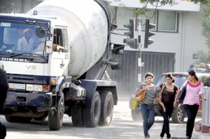 Pedestrians walk on the road at risk of losing life and limb