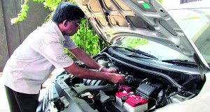 Rohan Silva of MLH inspecting an engine problem.