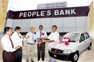 Picture shows Mr. V. Karuppaiah receiving the Susuki Car Alto from Mr. P. Sirisena People’s Bank Badulla Regional Manager. Assistant Regional Managers Mr. R.M. Ranbanda and Mr. K.P.S.L.Samarathunga and Mr. Manjula Dissanayake – Haputale Branch Manager are also present.