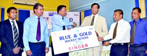 Royal College Principal Upali Gunasekara receiving the Singer sponsorship  					 	            - Pic by Hasitha Kulasekera