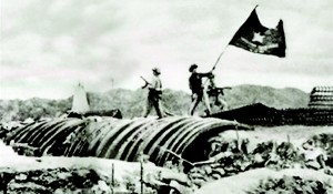 Viet Minh troops plant their flag over a captured French position.. Pic Wikipedia.com