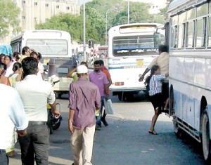 Our cameraman captured this picture of a young woman rushing  to the middle of the road and clambering into a bus