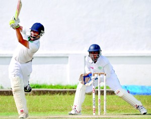 Dushan Nirmana Perera of Isipathana drives one to the fence - Pic by Ranjith Perera