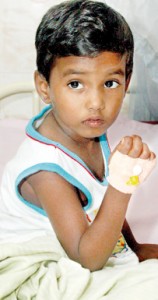 A young child receiving treatment and (left) two women being given oxygen. Pix by Indika Handuwala