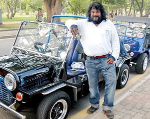 Cars that make people smile: Dr. Kesara Serasinghe  with his S. Thomas themed Mini Moke