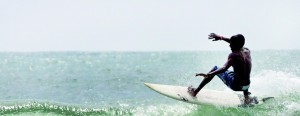 A Lankan surfer channels the momentum of a massive wave at Arugam Bay