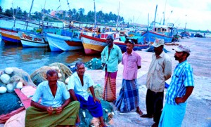 Fishermen on a beach in Moratuwa while away the time after they were prevented from going out to sea yesterday owing to rough and dangerous conditions triggered-off by a massive  cyclone that hit the eastern coast of India yesterday evening. Pic by Mangala Weerasekera
