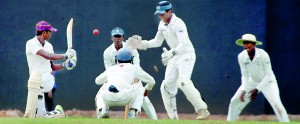 Prince of Wales batsman Sachith Pushpakumara sees his bails flying as he is bowled around the legs by the Thomian skipper Madushan Ravichandrakumar. - Pic by Amila Gamage