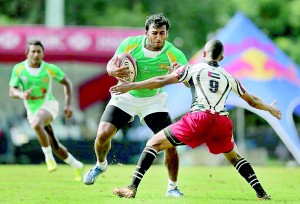 Sri Lanka’s Sajith Saranga bursts forward to score against United Arab Emirates during their 55-7 win in Mumbai yesterday. - Pic courtesy Dennis Muthuthantri/SLRFU