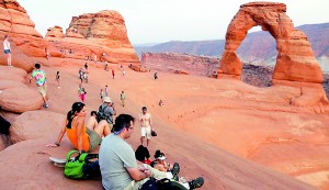Tourists gather at the Arches National Park in Moab, Utah.  Utah will reopen its national parks and monuments under a deal with the U.S. Department of the Interior (REUTERS)