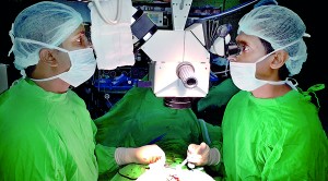 The operation underway with micro-surgery technology in use