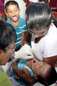 Cheek swab time at Kurunegala.  Pix by M.A. Pushpa Kumara