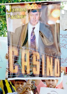 Demonstrators hold up placards including a poster of Australian gambling mogul James Packer during a protest in Colombo. - AFP