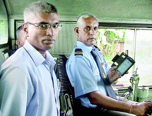 All aboard: The brains behind the Train traffic optimisation system Anura Pushpakumara Kasthoori (left) with an engine driver. Pic by Reka Tharangani